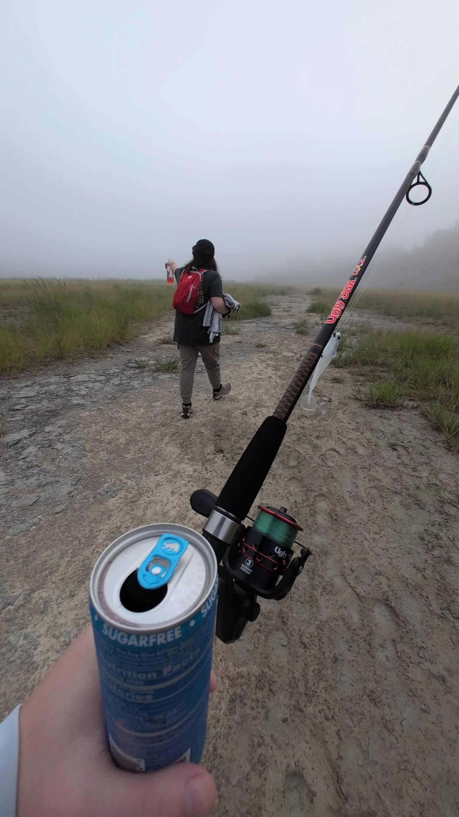 Emily Reynolds showing me where the fish are thru the fog